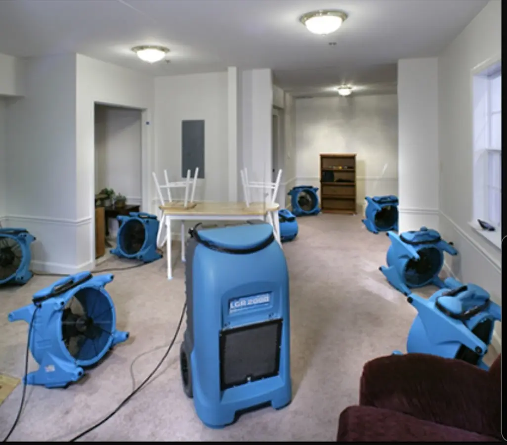 Air movers and dehumidifier setup for Water Damage Restoration in Fenton